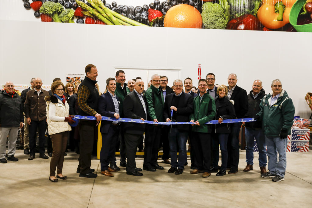 group of people at a ribbon cutting ceremony