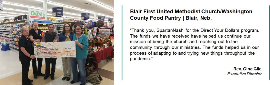 Blair First United Methodist Church/Washington County Food Pantry accept a giant check for $1000.