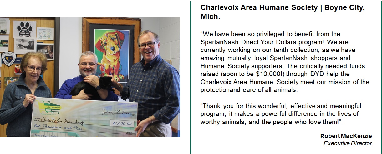 Charlevoix Area Humane Society accepting a giant check for $1000