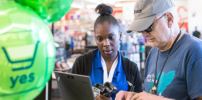 Associate assisting shopper at checkout